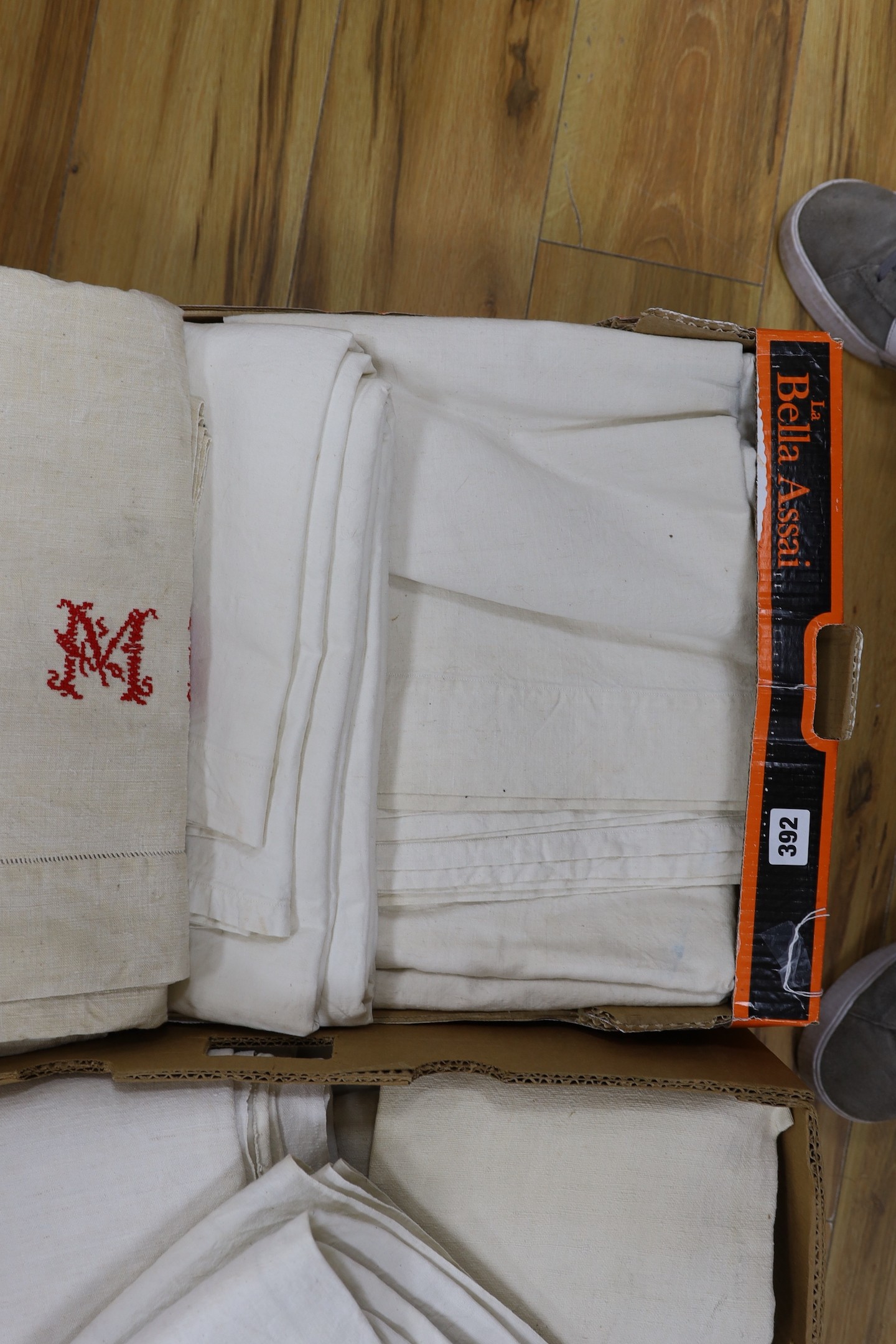 Two boxes of French Provincial linen sheets, some with red monograms